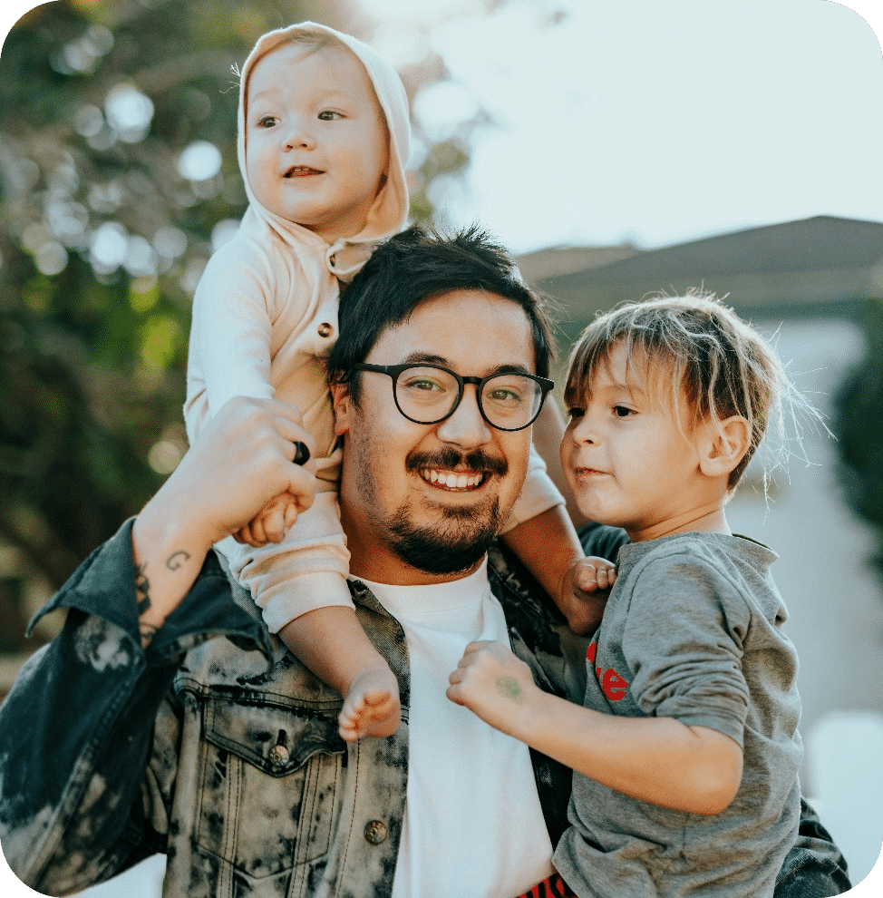 Man In White Shirt Carrying Girl In Gray Shirt