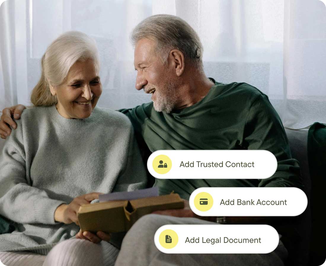 Older Couple On Sofa Reading A Document Over A Book